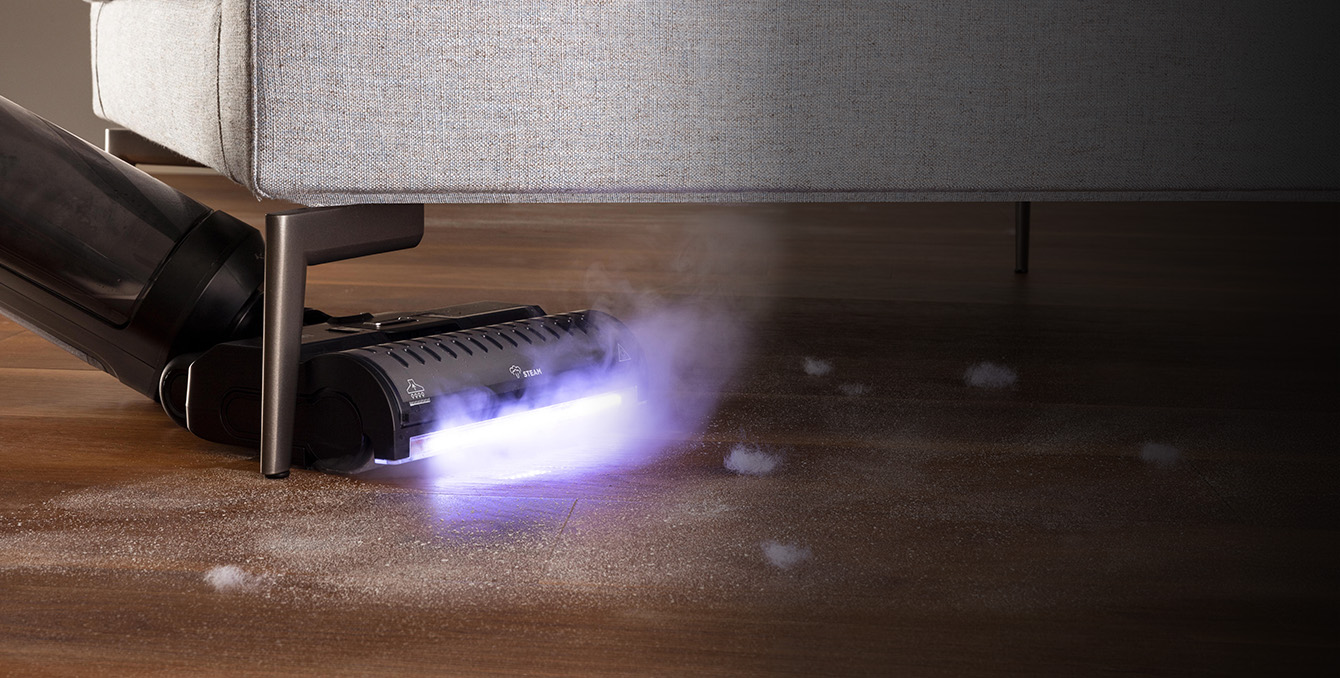 Polti RollySteam cleaning under a sofa